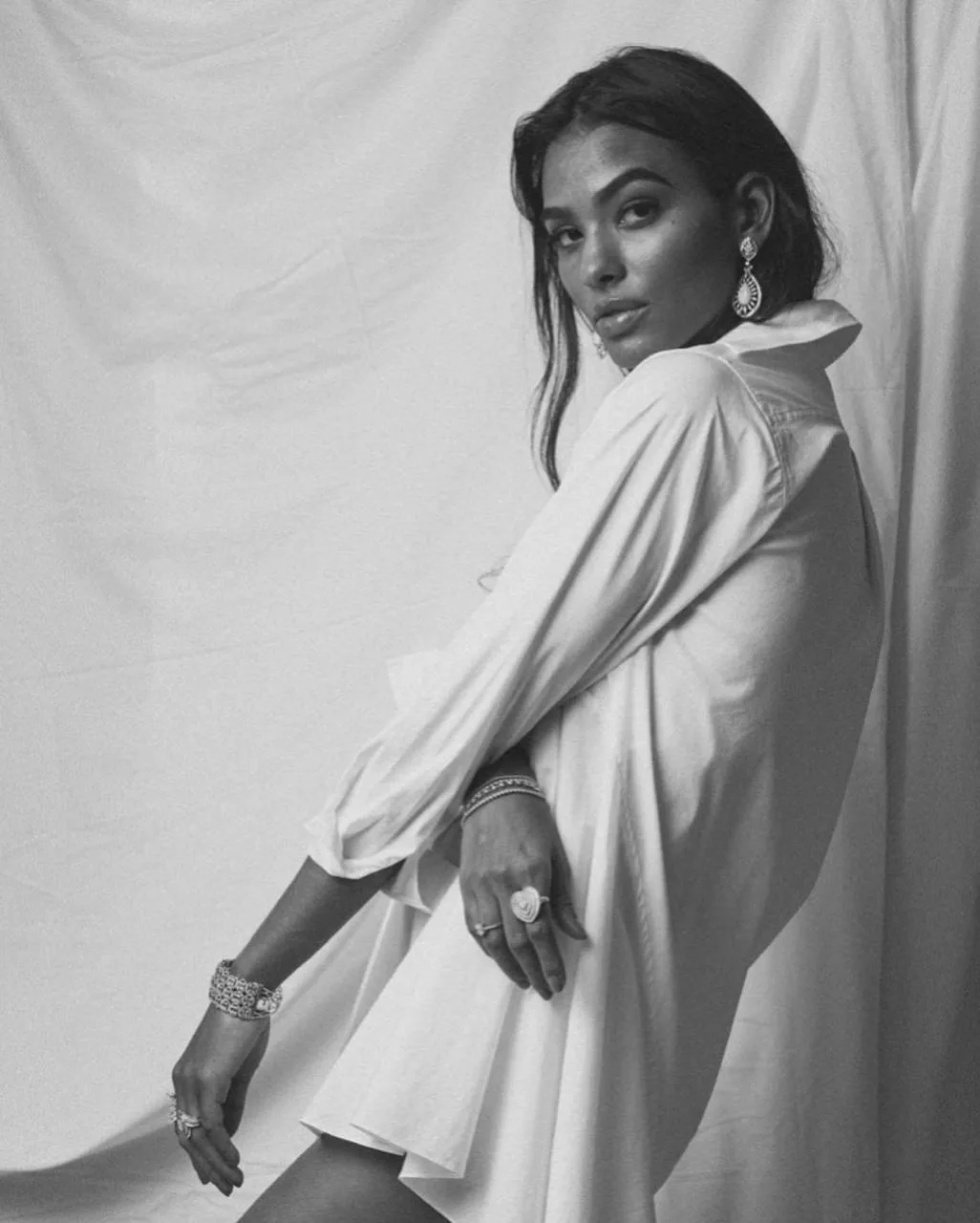 Black and white portrait of Anaiza Ferreira in an oversized shirt